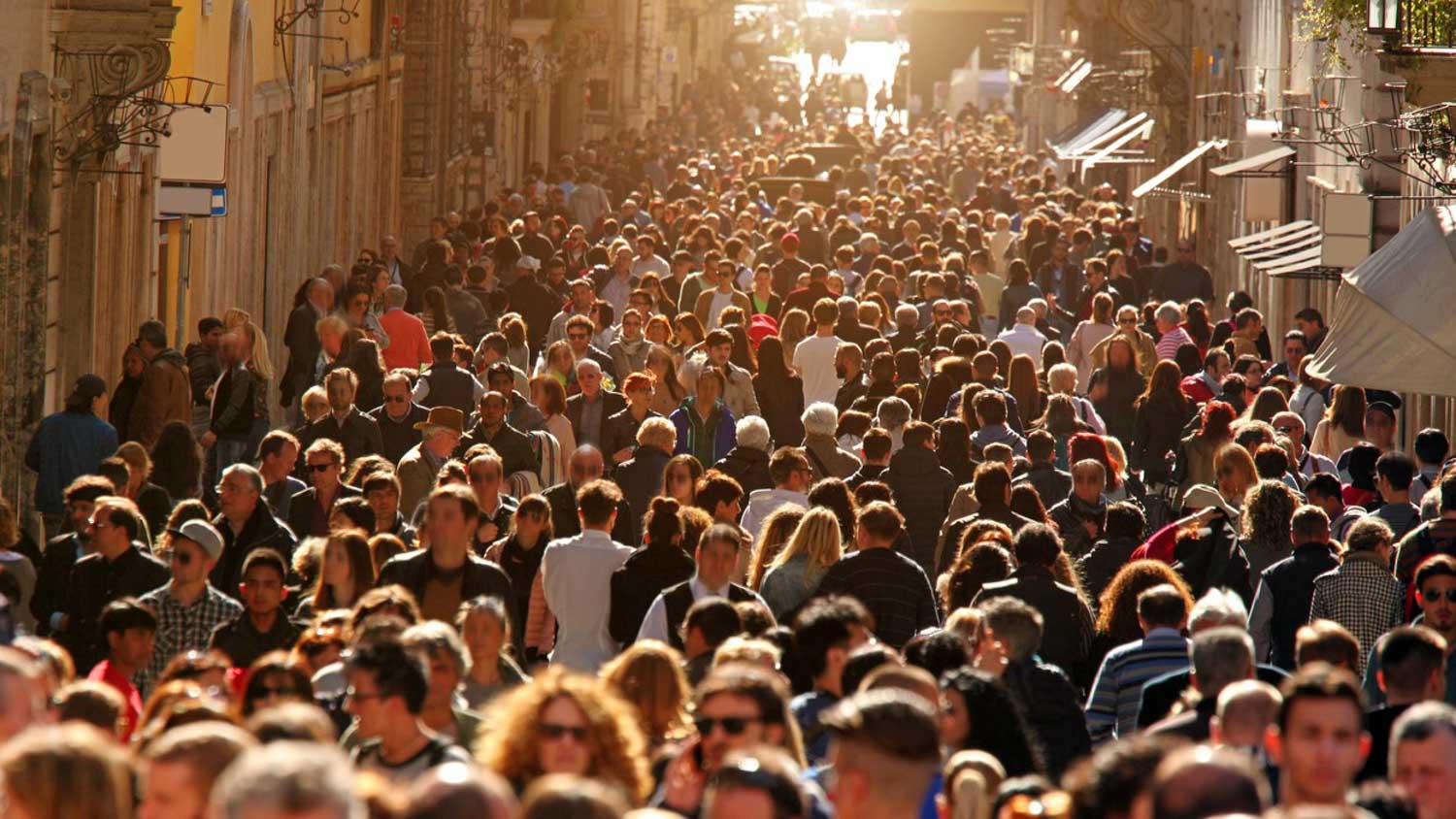 Crowd of people walking on street in downtown Rome