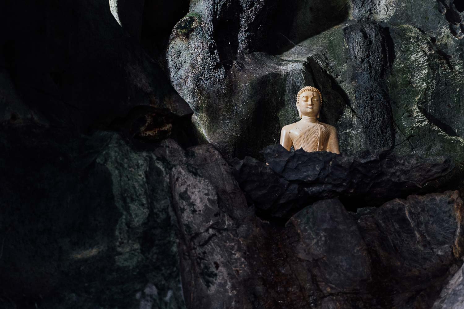 figure buddha inside cave