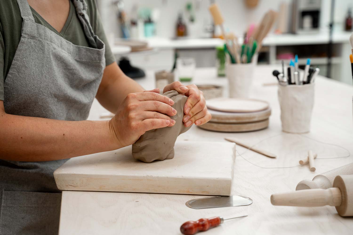 wedging clay before starting making pottery project create proper consistency removing air bubbles from clay before modeling avoid ruination ceramic product