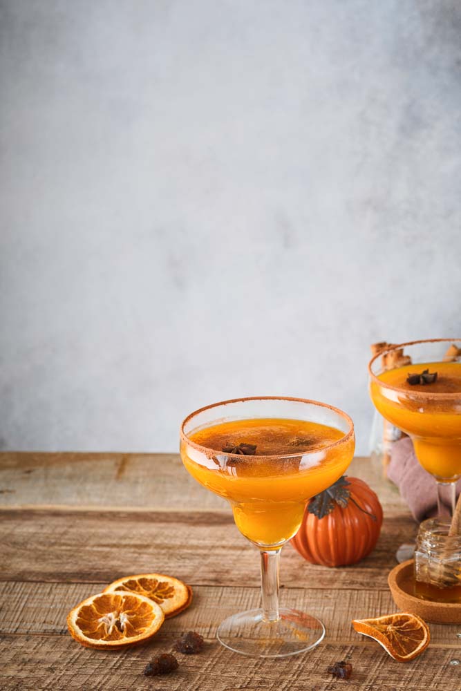 pumpkin cocktail with cinnamon orange juice cocoa glass mugs festive cocktail halloween margarita pumpkin autumn drink halloween thanksgiving